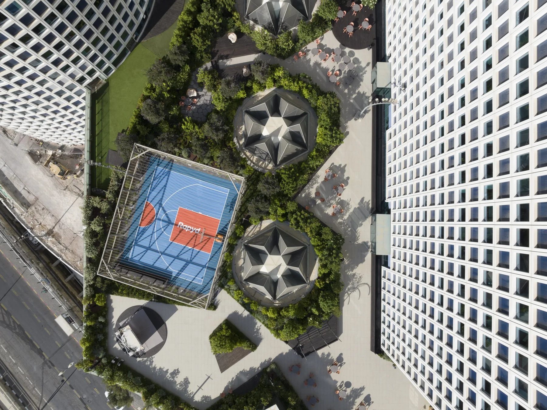 Aerial view of Rapyd's rooftop workplace and basketball court in Tel Aviv